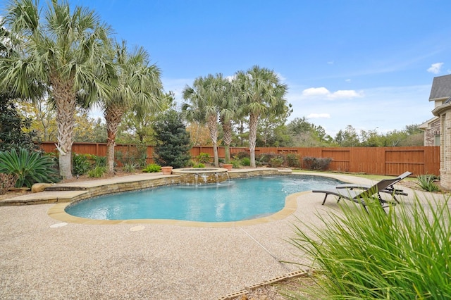 view of swimming pool featuring an in ground hot tub and a patio area