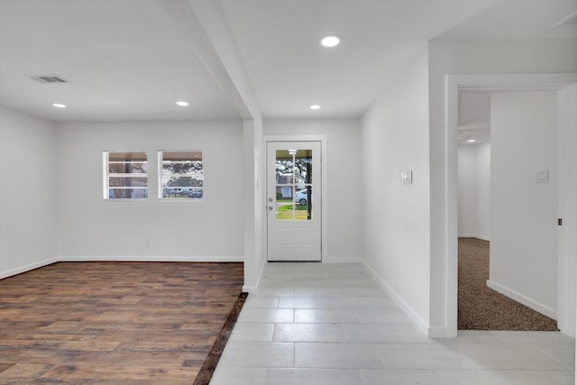 entryway featuring light tile patterned floors