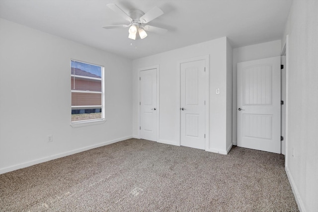 unfurnished bedroom featuring ceiling fan and carpet flooring