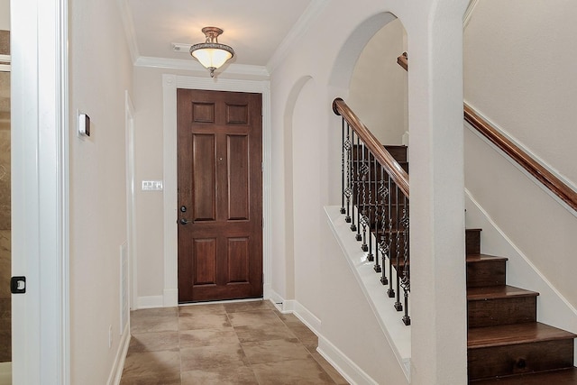 entryway featuring ornamental molding