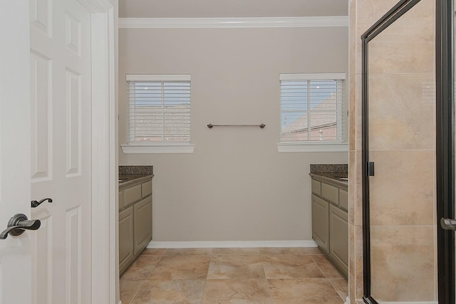 bathroom with a healthy amount of sunlight, vanity, a shower with door, and crown molding