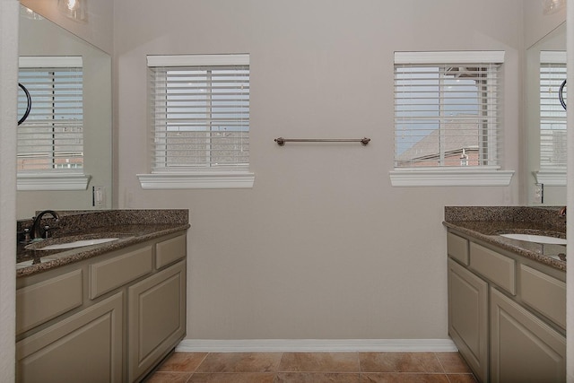 bathroom with tile patterned floors and vanity