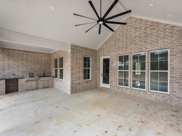 view of patio / terrace featuring ceiling fan, an outdoor kitchen, grilling area, and sink