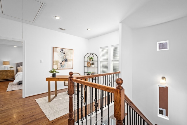 hall with hardwood / wood-style flooring