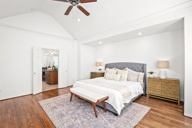 bedroom with hardwood / wood-style flooring, ceiling fan, and vaulted ceiling