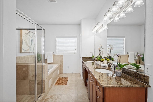 bathroom with vanity, tile patterned flooring, and separate shower and tub