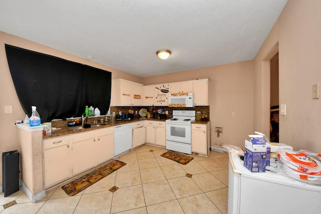 kitchen with light tile patterned floors, white cabinetry, decorative backsplash, white appliances, and sink