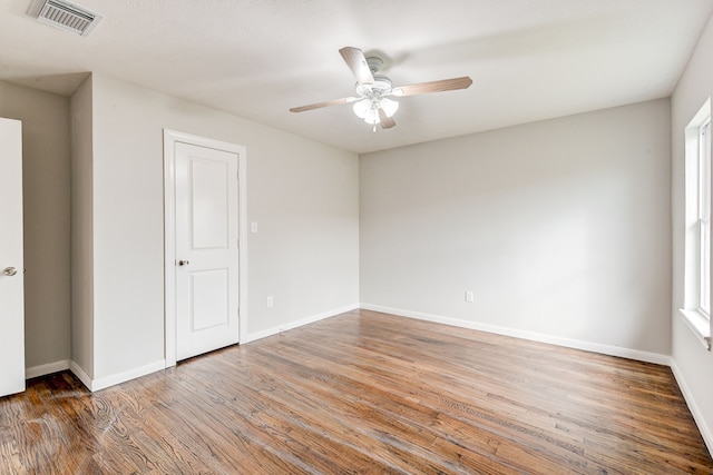 unfurnished room featuring ceiling fan and hardwood / wood-style floors