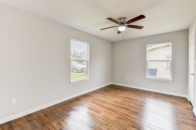 spare room featuring hardwood / wood-style flooring and ceiling fan