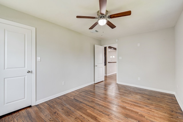 unfurnished room with ceiling fan and hardwood / wood-style floors