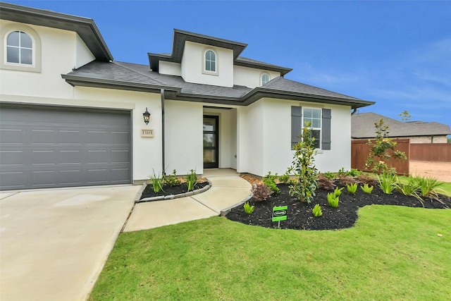 13115 Brookwood Bend Ln, Conroe, TX 77302 - view of front of property featuring stucco siding, concrete driveway, a garage, and a shingled roof