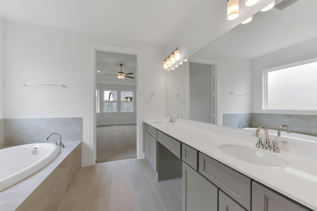13115 Brookwood Bend Ln, Conroe, TX 77302 - full bath featuring tile patterned flooring, a bath, double vanity, and ceiling fan
