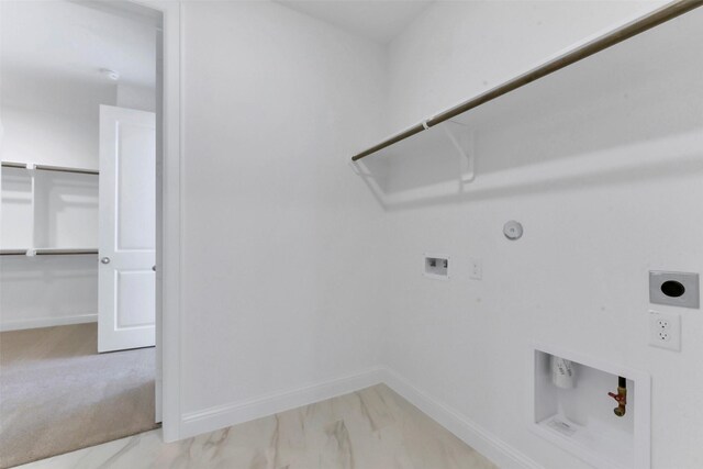 13115 Brookwood Bend Ln, Conroe, TX 77302 - clothes washing area featuring electric dryer hookup, hookup for a gas dryer, washer hookup, baseboards, and marble look tiles