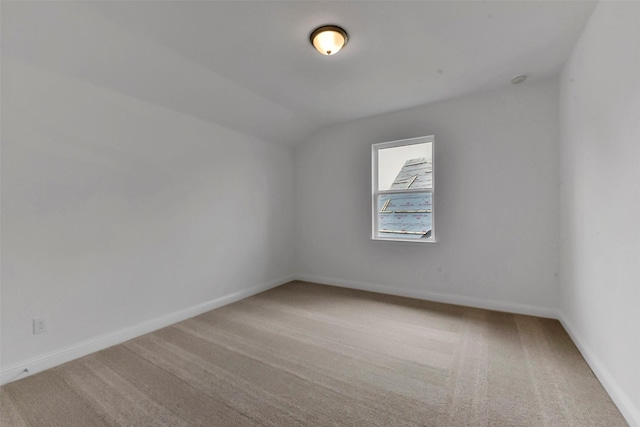 13115 Brookwood Bend Ln, Conroe, TX 77302 - empty room with carpet flooring, baseboards, and vaulted ceiling