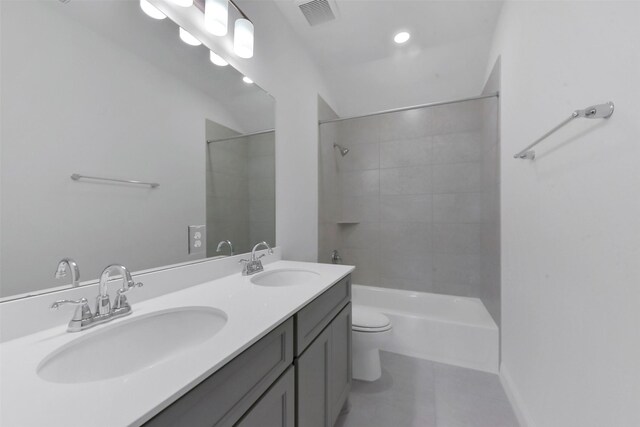 13115 Brookwood Bend Ln, Conroe, TX 77302 - bathroom with toilet, tile patterned floors, double vanity, shower / tub combination, and recessed lighting