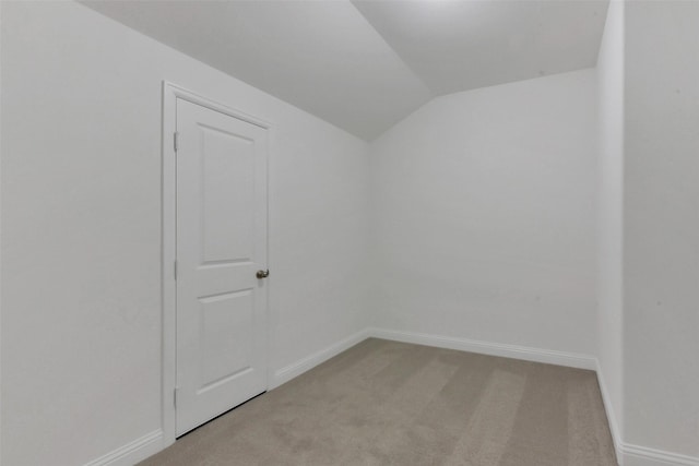 13115 Brookwood Bend Ln, Conroe, TX 77302 - unfurnished room with lofted ceiling, light colored carpet, and baseboards