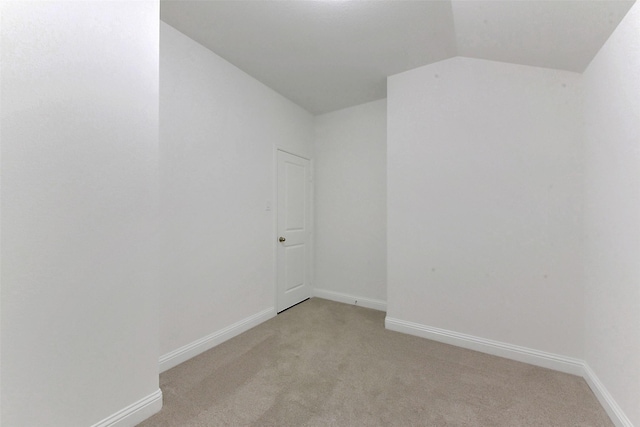 13115 Brookwood Bend Ln, Conroe, TX 77302 - unfurnished room with light colored carpet, vaulted ceiling, and baseboards