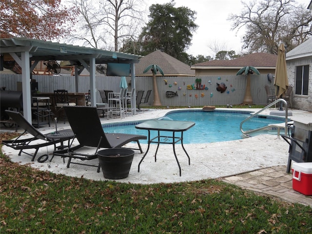 view of swimming pool with a patio area