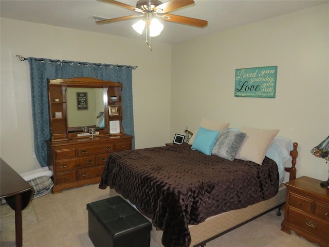 bedroom featuring light carpet and ceiling fan