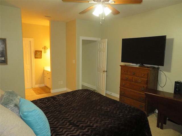 bedroom with ceiling fan and ensuite bath