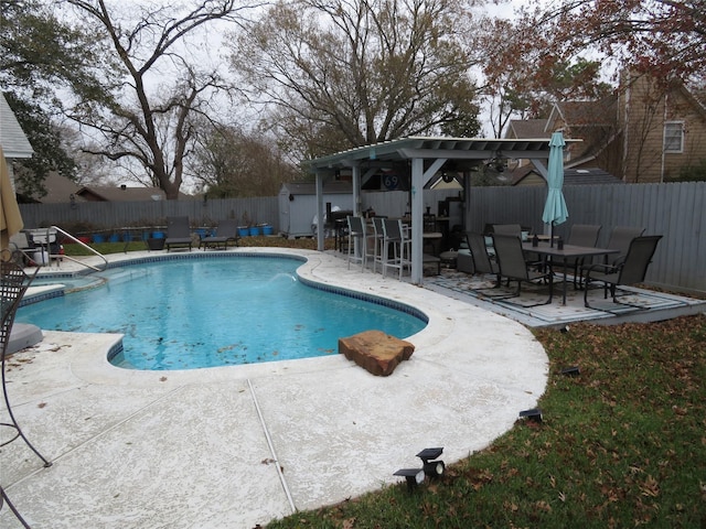 view of pool with a pergola and a patio area