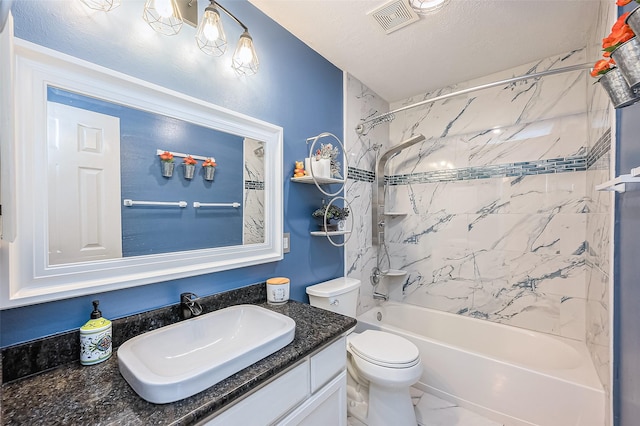 full bathroom with a textured ceiling, toilet, vanity, and shower / washtub combination