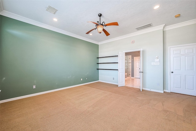 unfurnished bedroom with ceiling fan, crown molding, a textured ceiling, and carpet flooring