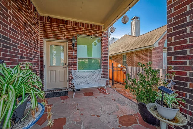 entrance to property featuring a patio area