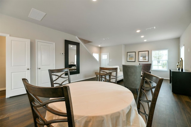 dining space featuring dark hardwood / wood-style floors