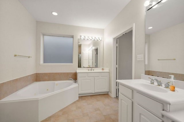 bathroom with vanity and a bathing tub