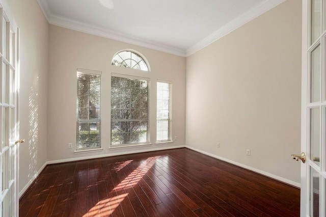 unfurnished room featuring ornamental molding, hardwood / wood-style floors, and french doors