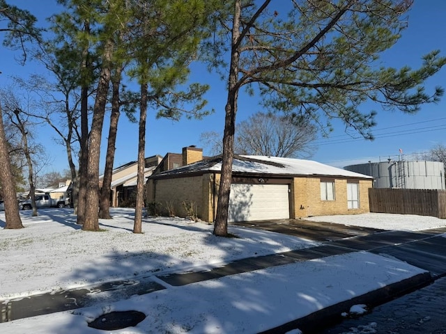 single story home featuring a garage