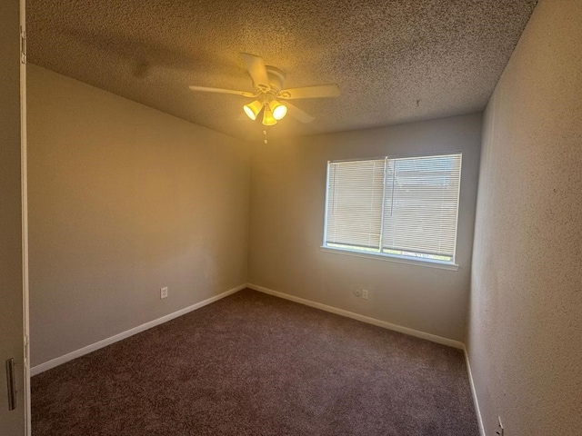 spare room with ceiling fan, carpet flooring, and a textured ceiling