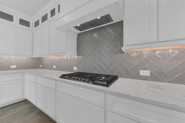 16163 Sheridan River Trl, Conroe, TX 77302 - kitchen with stainless steel gas cooktop and white cabinets