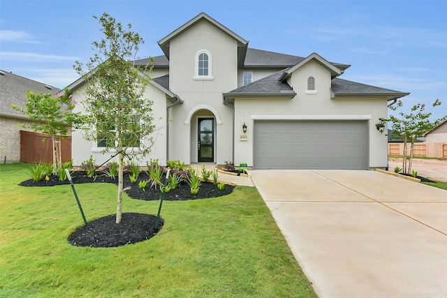 16163 Sheridan River Trl, Conroe, TX 77302 - view of front of property with stucco siding, driveway, a front yard, roof with shingles, and an attached garage