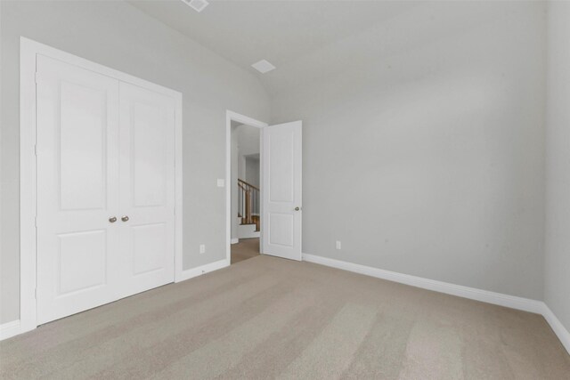 16163 Sheridan River Trl, Conroe, TX 77302 - unfurnished bedroom featuring carpet, a closet, and baseboards