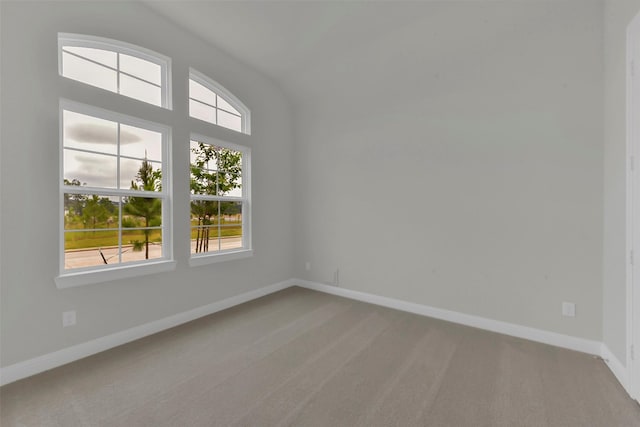 16163 Sheridan River Trl, Conroe, TX 77302 - empty room with carpet, healthy amount of natural light, baseboards, and vaulted ceiling