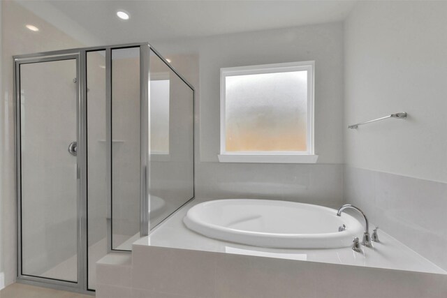 16163 Sheridan River Trl, Conroe, TX 77302 - bathroom featuring a stall shower, a bath, and recessed lighting
