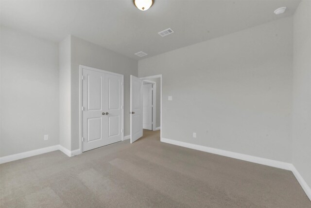 16163 Sheridan River Trl, Conroe, TX 77302 - unfurnished bedroom featuring carpet floors, baseboards, and a closet
