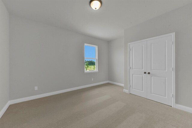 16163 Sheridan River Trl, Conroe, TX 77302 - unfurnished bedroom featuring carpet floors, baseboards, and a closet