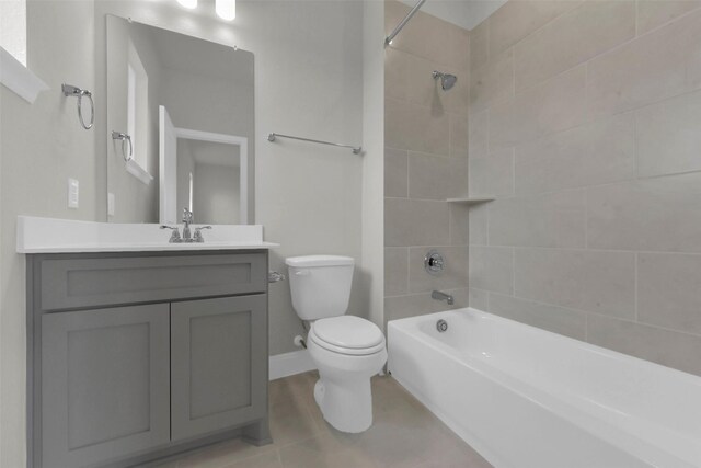 16163 Sheridan River Trl, Conroe, TX 77302 - full bathroom featuring washtub / shower combination, toilet, vanity, tile patterned flooring, and baseboards