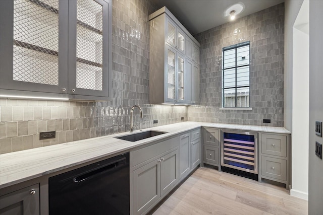 kitchen featuring light hardwood / wood-style floors, gray cabinets, wine cooler, dishwasher, and sink