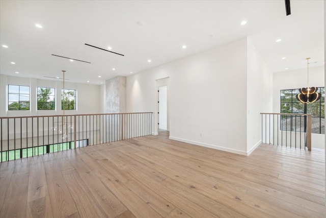 spare room featuring light wood-type flooring