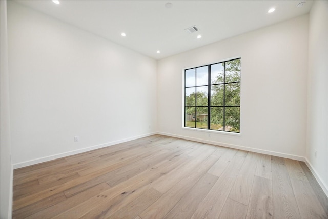 unfurnished room featuring light wood-type flooring