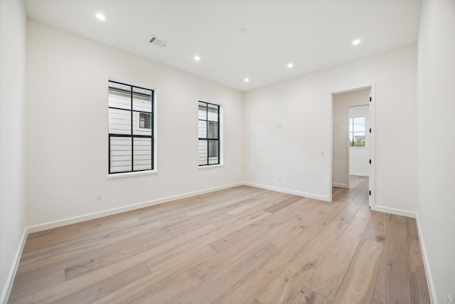 spare room with light hardwood / wood-style floors