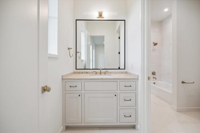 bathroom featuring shower / tub combination, tile patterned flooring, and vanity