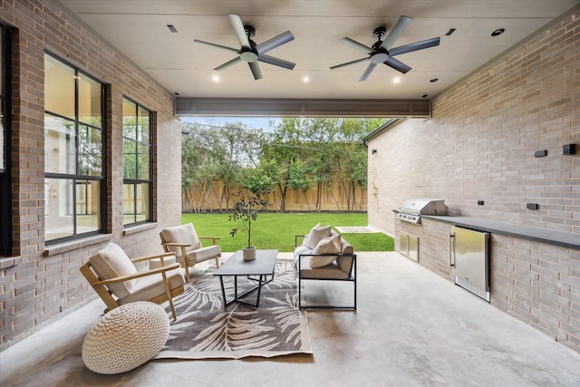 view of patio / terrace featuring ceiling fan, an outdoor living space, and area for grilling