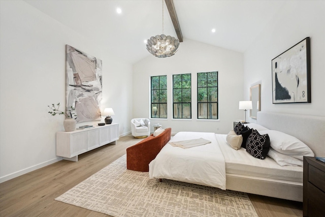 bedroom with a chandelier, beam ceiling, light hardwood / wood-style floors, and high vaulted ceiling