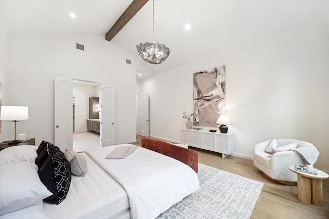 bedroom featuring ensuite bathroom, a notable chandelier, beamed ceiling, light wood-type flooring, and high vaulted ceiling