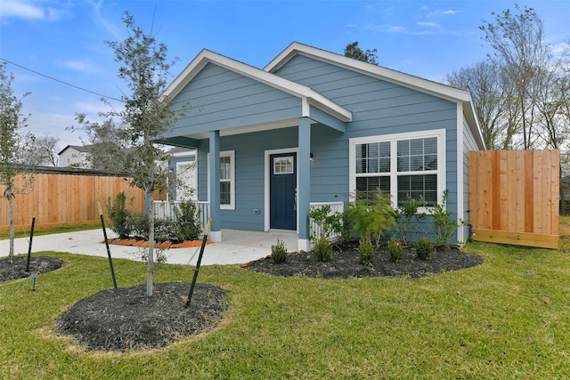 bungalow-style house featuring a front yard and a porch